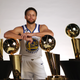 Stephen Curry #30 of the Golden State Warriors poses with the four Larry O’Brien Championship Trophies that he has won with the Warriors during the Warriors Media Day on September 25, 2022 in San Francisco, California. (Photo by Ezra Shaw/Getty Images)